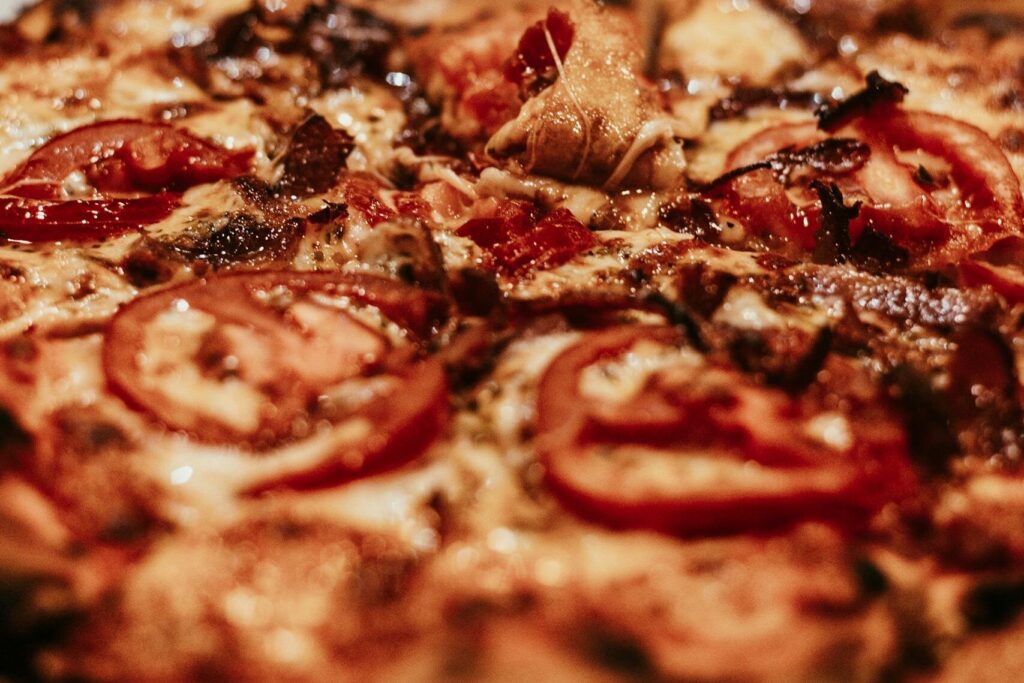 Delicious close-up of a freshly baked, mouthwatering Italian pizza with toppings.